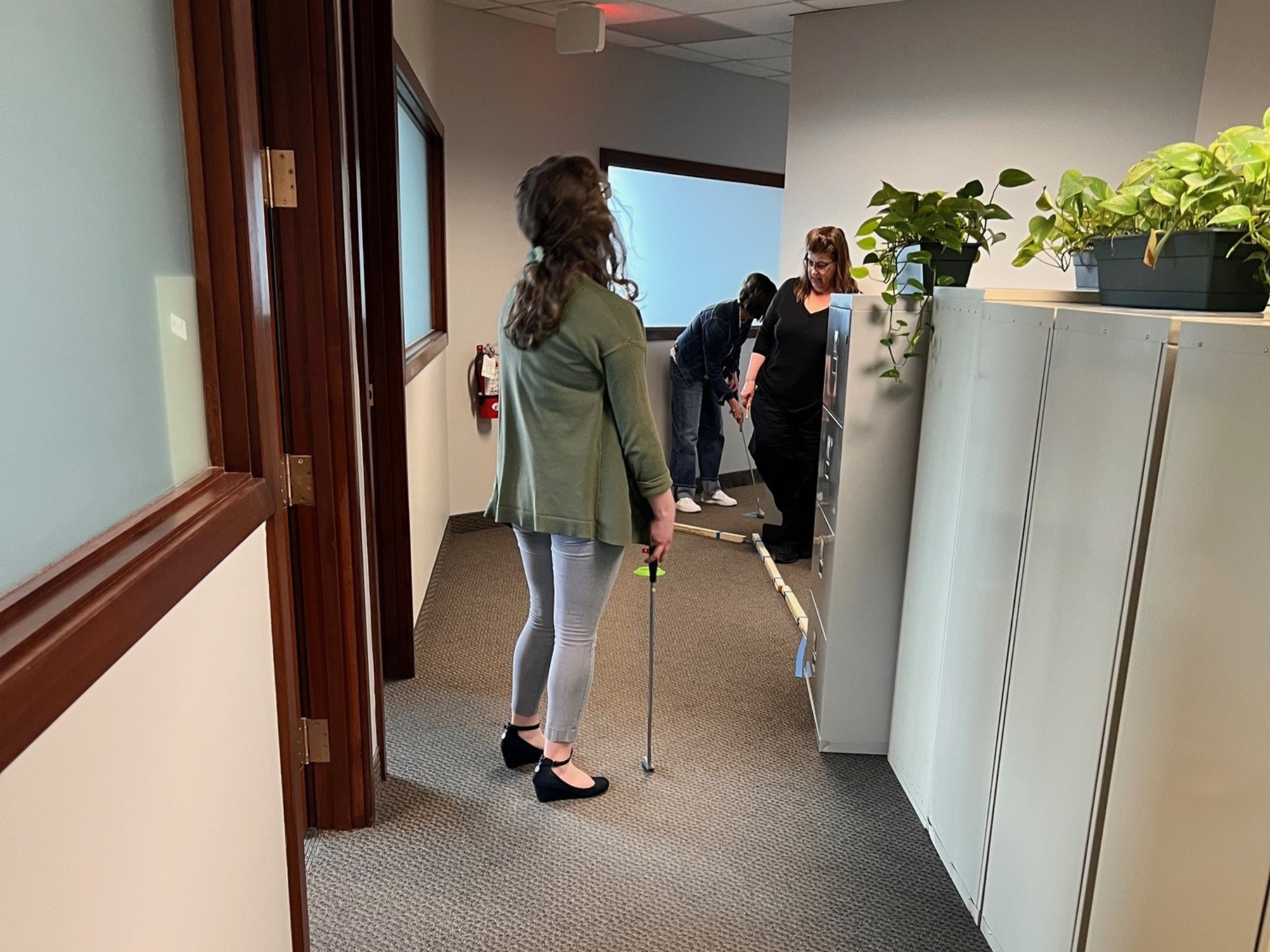 Evans Fox Team Golfing in the office